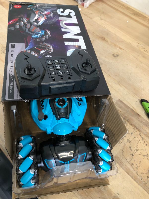 Photo 1 of RC Stunt Car,2.4GHz 4WD Remote Control Gesture Sensing Toy Cars,Double Sided Driving,360 °Rotation,Off Road Vehicle,Hand Controlled RC Car with Lights&Music, Birthday Gifts for Boys&Girls(Blue)