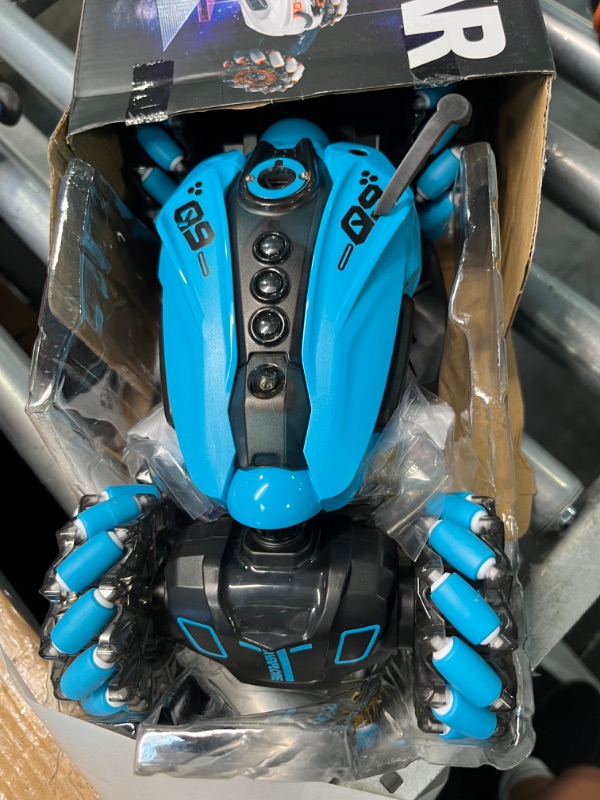 Photo 1 of RC Stunt Car,2.4GHz 4WD Remote Control Gesture Sensing Toy Cars,Double Sided Driving,360 °Rotation,Off Road Vehicle,Hand Controlled RC Car with Lights&Music, Birthday Gifts for Boys&Girls(Blue)