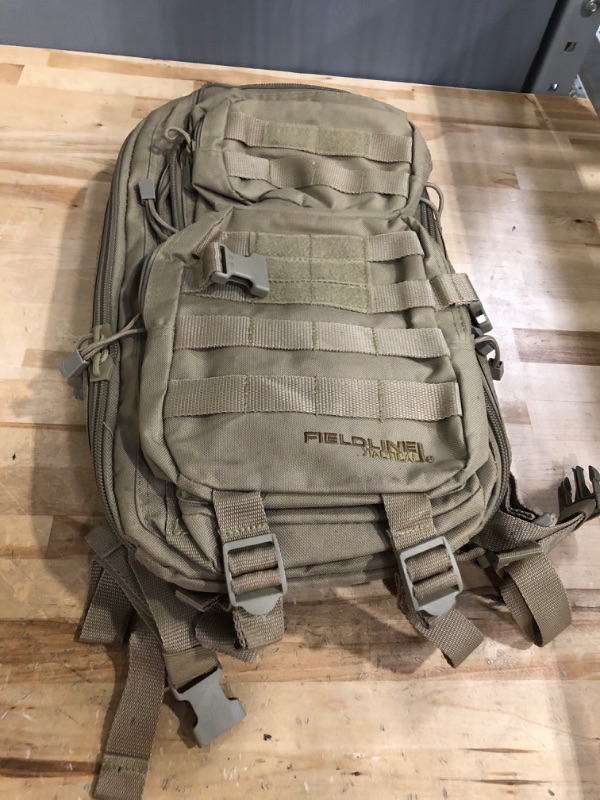 Photo 1 of Surge Tactical Hydration Pack by Fieldline | Military Backpack with MOLLE System | Survival Bug Out Bag | 22L Storage Capacity + 3L Reservoir Coyote