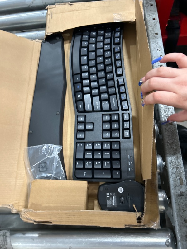 Photo 2 of Amazon basic keyboard mouse and arm rest 