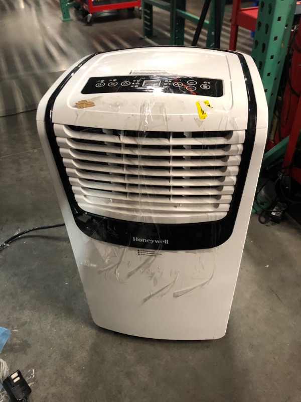 Photo 9 of ***USED - DIRTY - POWERS ON - NO PACKAGING - SEE PICTURES***
Honeywell 9,000 BTU Portable Air Conditioner for Bedroom, Living Room, Apartment, 115V, Cools Rooms Up to 400 Sq. Ft. with Dehumidifier & Fan, 24-hour Timer, Remote, White/Black Up to 400 Sq. Ft