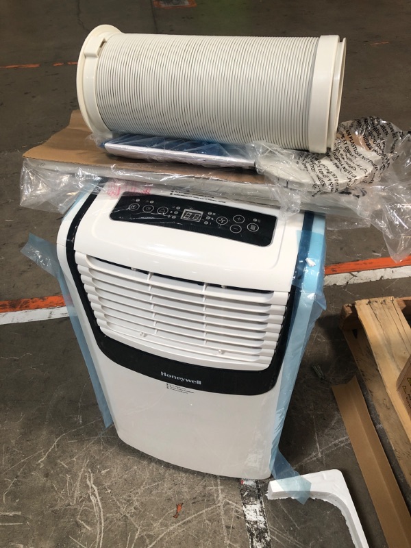 Photo 2 of ***USED - DIRTY - POWERS ON - NO PACKAGING - SEE PICTURES***
Honeywell 9,000 BTU Portable Air Conditioner for Bedroom, Living Room, Apartment, 115V, Cools Rooms Up to 400 Sq. Ft. with Dehumidifier & Fan, 24-hour Timer, Remote, White/Black Up to 400 Sq. Ft