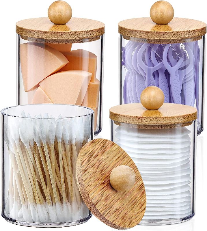 Photo 1 of 4 Pack Qtip Holder Dispenser with Bamboo Lids - 10 oz Clear Plastic Apothecary Jar Containers for Vanity Makeup Organizer Storage - Bathroom Accessories Set for Cotton Swab, Ball, Pads, Floss****USED***ALL THE CONTAINERS ARE CRACKED ACCEPT FOR ONE***4 LID