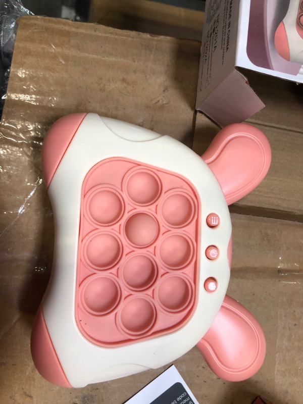 Photo 1 of Quick Push Toy with Lights, Fast Push Game, Fast Push Bubble Game, Children's Decompression Breakthrough Puzzle Game Machine for Kids, Children and Adults (Pink)