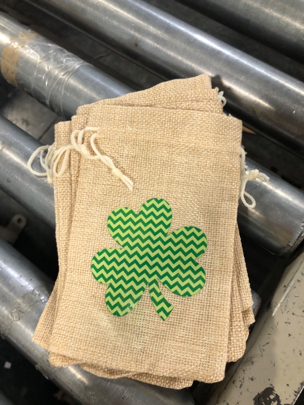 Photo 3 of Whaline 12Pcs St. Patrick's Day Party Favor Bag Glitter Lucky Shamrock Bag with Drawstring Rustic Burlap Linen Gift Bag Chocolate Sweet Bag Goodie Bag for Irish Party Leprechaun Treasure Hunt Prizes