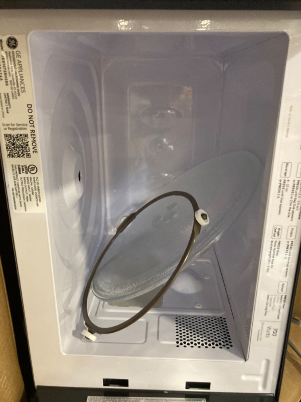 Photo 4 of ****USED**PARTS ONLY***SOLD AS IS***NO RETURNS***ALL SALES ARE FINAL*** GE Countertop Microwave Oven, Compact 0.7 Cubic Ft., 700-watt Capacity, 6 Auto Cooking Settings, Kitchen Essentials for the Countertop, Dorm Room or Apartment, Stainless Steel