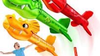 Photo 1 of ****NO RETURNS FINAL SALES**
 Dino Blasters, Rocket Launcher for Kids - Launch up to 100 ft. Birthday Gift, for Boys & Girls Age 3, 4, 5, 6, 7, Years Old - Outdoor Toys, Family Fun, Dinosaur Toy, Kids Toys