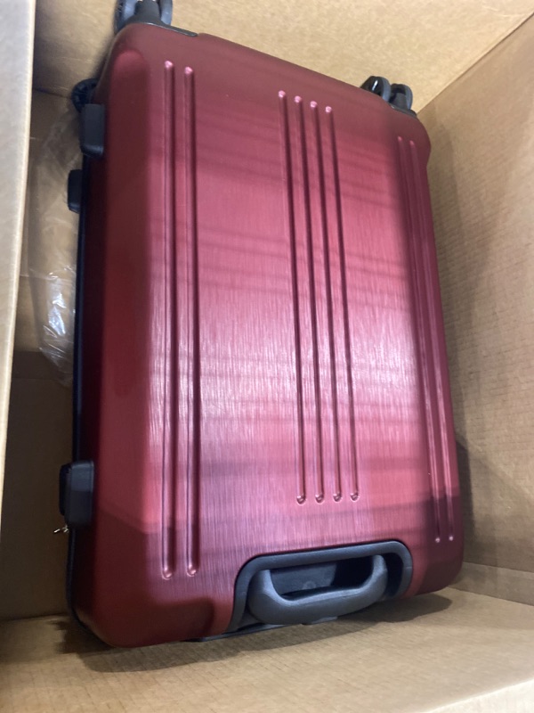 Photo 1 of burgundy luggage 