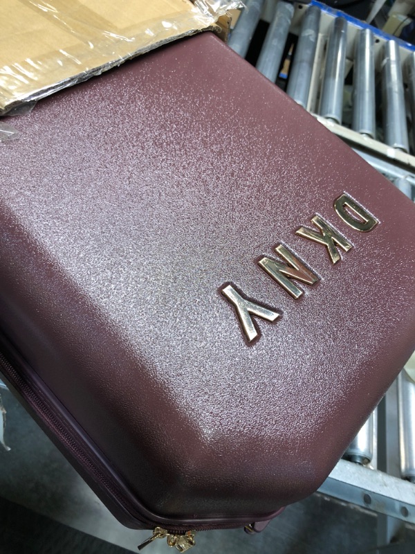 Photo 3 of *** MAJOR DAMAGED******FOR PARTS ONLY NO RETURNS***
DKNY Luggage Upright with 8 Spinner Wheels, ABS+PC Case, Weekend Bag, Burgundy, 21" Carry On