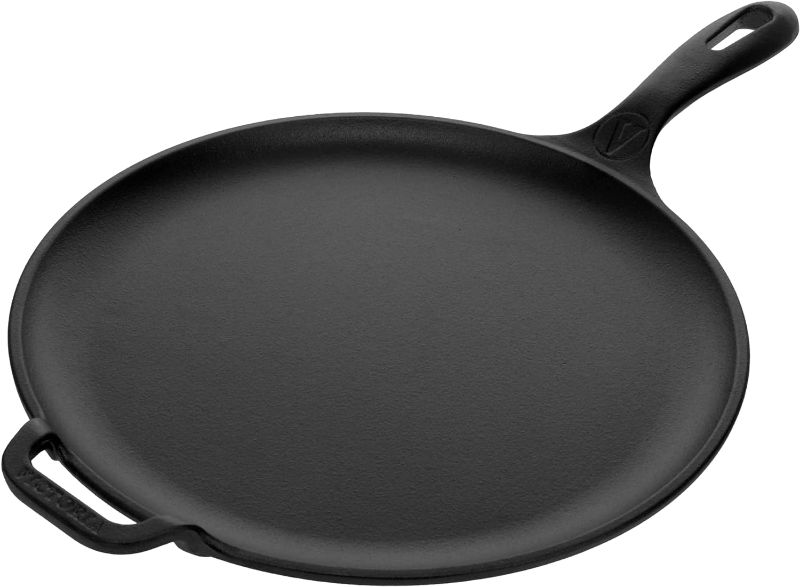 Photo 1 of **VERY USED** Victoria 12-Inch Cast Iron Comal Pizza Pan with a Long Handle and a Loop Handle, Preseasoned with Flaxseed Oil, Made in Colombia
