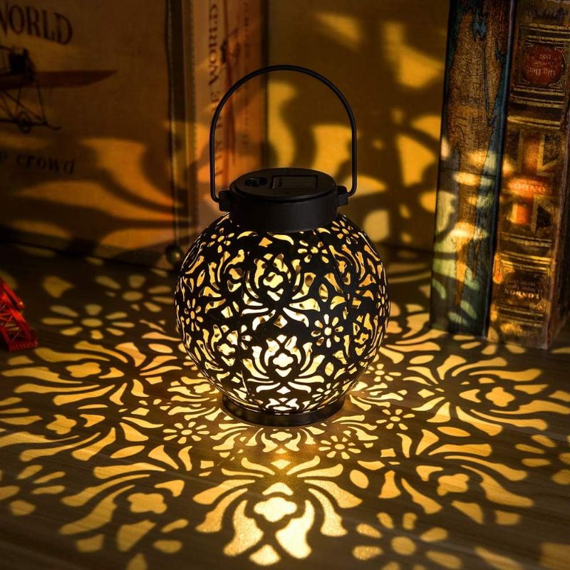 Photo 1 of 2 Pack Outdoor Solar Hanging Lantern Light LED Decorative Christmas Light for Garden Patio Courtyard Lawn and Tabletop with Hollowed-Out Design. Unique Gardening Gifts for Women.
