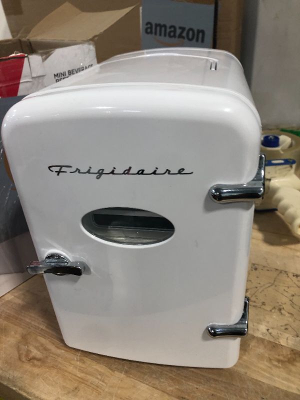 Photo 4 of *** NOT FUNCTIONAL****** FINAL SALE AS IS NO RETURNS****
Frigidaire EFMIS129-WHITE 6 Can Beverage Cooler, White,4 Liters WHITE Cooler