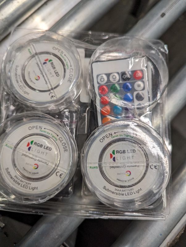 Photo 1 of Submersible Led Lights Battery Operated Spot Lights with Remote Small Lamps Decorative Fish Bowl Light Remote Controlled Small Led Lights for Aquarium Vase Base Pond Wedding Halloween Party (4 Pack) 10 LEDs