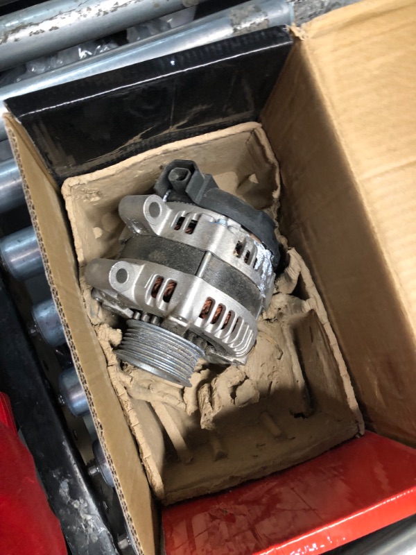 Photo 1 of ***UNABLE TO IDENTIFY EXACT ITEM - STOCK PHOTO FOR REFERENCE ONLY - ACTUAL ITEM MAY DIFFER - SEE COMMENTS***
Automotive Car Alternator, Silver/Black, Metal/Plastic