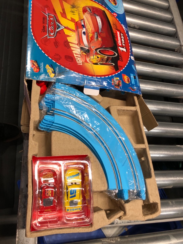 Photo 2 of Carrera First Disney/Pixar Cars - Slot Car Race Track - Includes 2 Cars: Lightning McQueen and Dinoco Cruz - Battery-Powered Beginner Racing Set for Kids Ages 3 Years and Up Disney Cars w/ Spinners