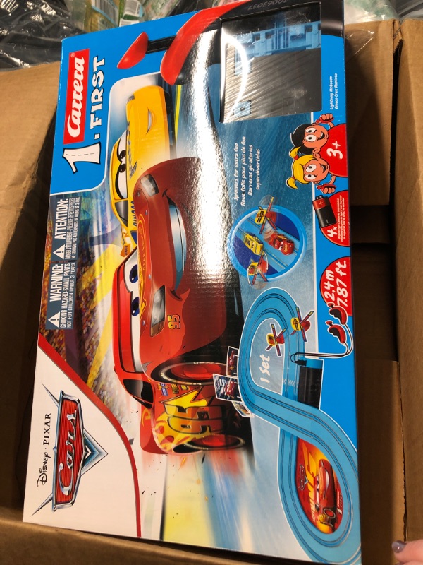 Photo 2 of Carrera First Disney/Pixar Cars - Slot Car Race Track - Includes 2 Cars: Lightning McQueen and Dinoco Cruz - Battery-Powered Beginner Racing Set for Kids Ages 3 Years and Up Disney Cars w/ Spinners