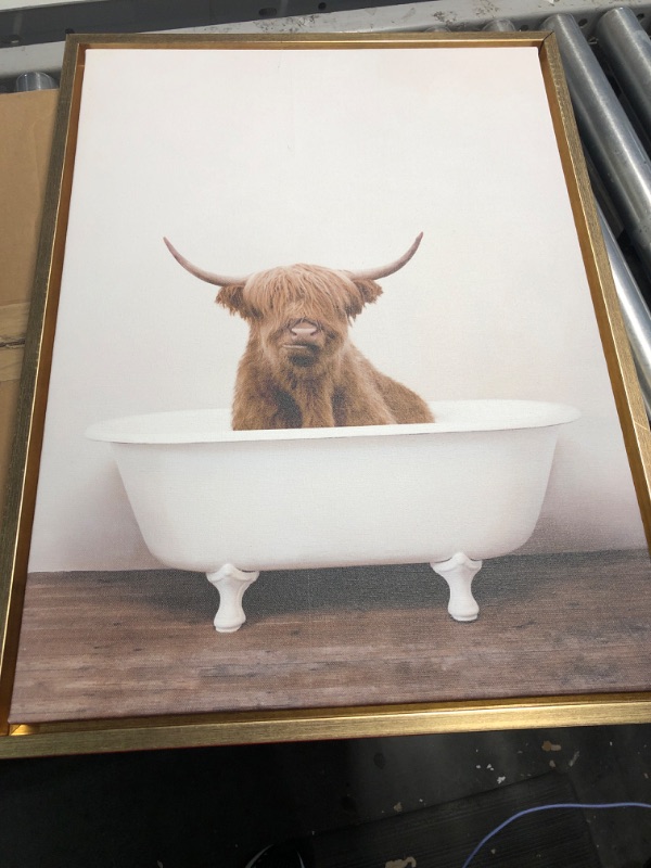 Photo 2 of **READ NOTES***
Kate and Laurel Sylvie Highland Cow in Tub Color Framed Canvas Wall Art by Amy Peterson, 18x24 Natural, Chic Animal Art for Wall