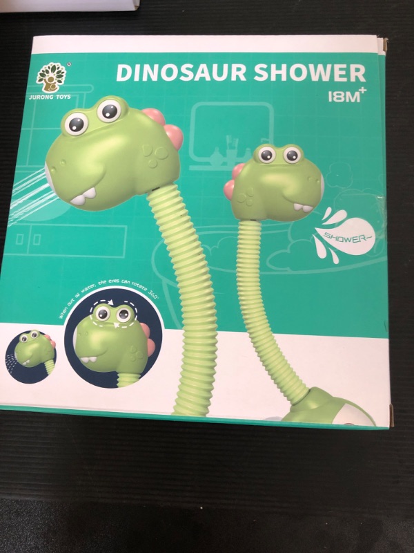 Photo 2 of Baby Bath Toy with Shower Head, 2 Suction Spinner Toys Swimming Turtles Floating Wind Up Toys, Squeeze Ball Dinosaur Egg, Dinosaur Sprinkler Shower Faucet Water Pump Bathtub Toy for Boys Girls Shower Head+Spinners+Wind Up Toys