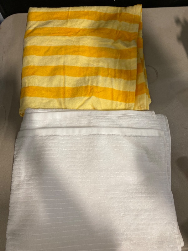 Photo 1 of 1 Orange & Yellow towel, 1 White towel. 