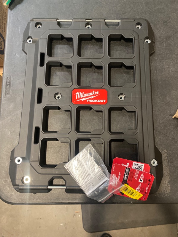 Photo 2 of Milwaukee Packout Mounting Plate - Quick alignment tabs; Metal reinforced mounting points; 150 lbs. wall mounted capacity; Impact resistant polymer body; Mounting positions spaced for 16 in. on-center stud installation; Wall and floor mounting; Fully cust