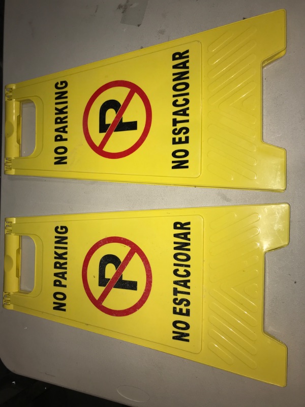 Photo 2 of Outdoor No Parking Signs 2 Pack, Two-Sided Folding Floor Sign with Symbol, Includes English & Spanish No Estacionar Message, Yellow Portable Folding No Parking Sign for Business Lots