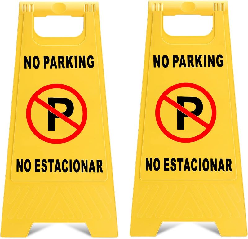 Photo 1 of Outdoor No Parking Signs 2 Pack, Two-Sided Folding Floor Sign with Symbol, Includes English & Spanish No Estacionar Message, Yellow Portable Folding No Parking Sign for Business Lots