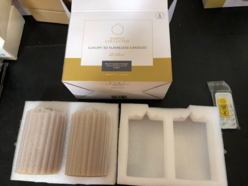 Photo 2 of Battery Operated Candles with Remote 2PK - Flickering 3D Moving Flame, LED Flameless Candle with Timer Runs 800+ Hrs, Textured Real Wax Pillar, Spring Decor set of 2 Ribbed Honey, 3x6 inch Honey Beeswax 3.15 x 6 inch (2pk + Rmte)