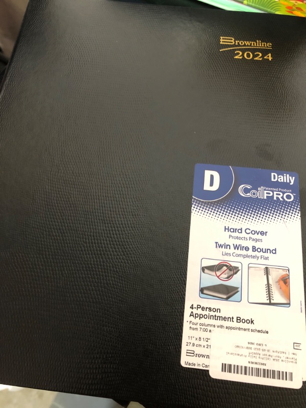 Photo 2 of Brownline 2024 CoilPro Daily Professional Planner, Four-Person Appointment Book, 12 Months, January to December, Twin-Wire Binding, 11" x 8.5", Black (CB960C.BLK-24)
