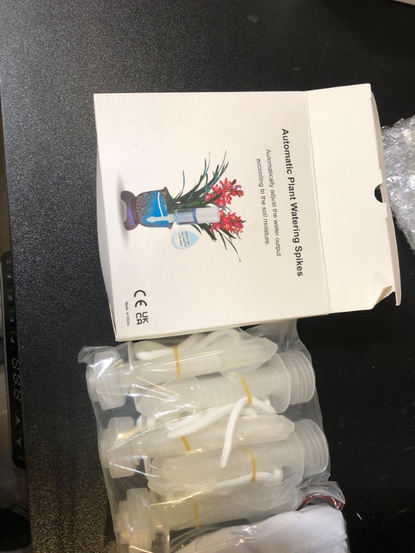 Photo 1 of GREENPARA Self Watering Spikes, Indoor Plant Automatic Watering System Devices for Indoor Potted Plants Planter On Vacations Plant Waterer Sitter, Self Watering Insert Stakes Cord Rope 5-Pack