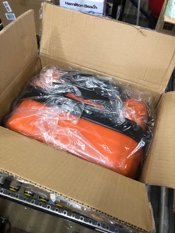 Photo 2 of Amazon Basics 21-Inch Hardside Spinner, Orange Orange 21-inch Spinner