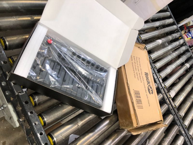 Photo 1 of RockJam 25 Key Bluetooth MIDI Keyboard with 8 Velocity Sensitive Touchpads, 8 Knobs & 360 Thumbstick.