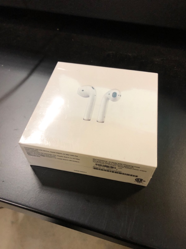 Photo 2 of Apple AirPods (2nd Generation) Wireless Ear Buds, Bluetooth Headphones with Lightning Charging Case Included, Over 24 Hours of Battery Life, Effortless Setup for iPhone
