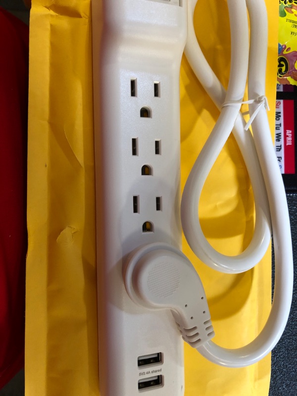 Photo 2 of nn. 4 Outlets Surge Protector with 2 USB Ports, 2.5ft cable-White color
