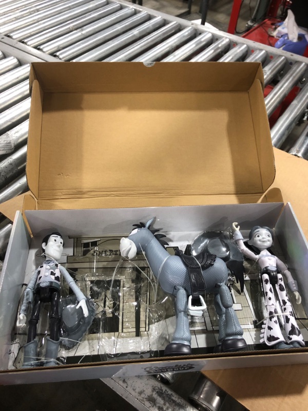 Photo 1 of Mattel Disney and Pixar Toy Story Set of 4 Action Figures with Mon0chromatic Woody, Jessie, Bullseye & Stinky Pete, Woody's Roundup, 7-in Scale Black & White