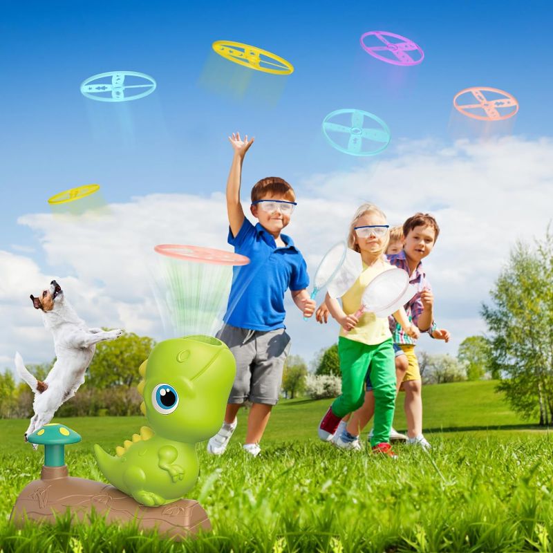 Photo 1 of Outdoor Toys for Kids 3 4 5 6 7 8 Year Old Boys Girls Toddlers, Dinosaur Flying Disc Launcher Toys for Outside Backyard Family Games, Catching Games, Christmas Birthday Party Gift 