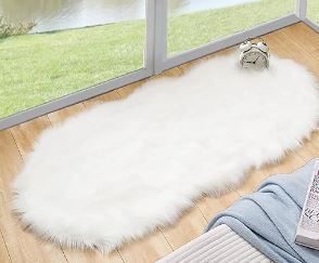 Photo 1 of ORINOVA White Faux Sheepskin Fuzzy Fur Rugs for Bedroom Small Machine Washable Fluffy Area Rugs for Living Room 2x4 Shag Nursery Rug 