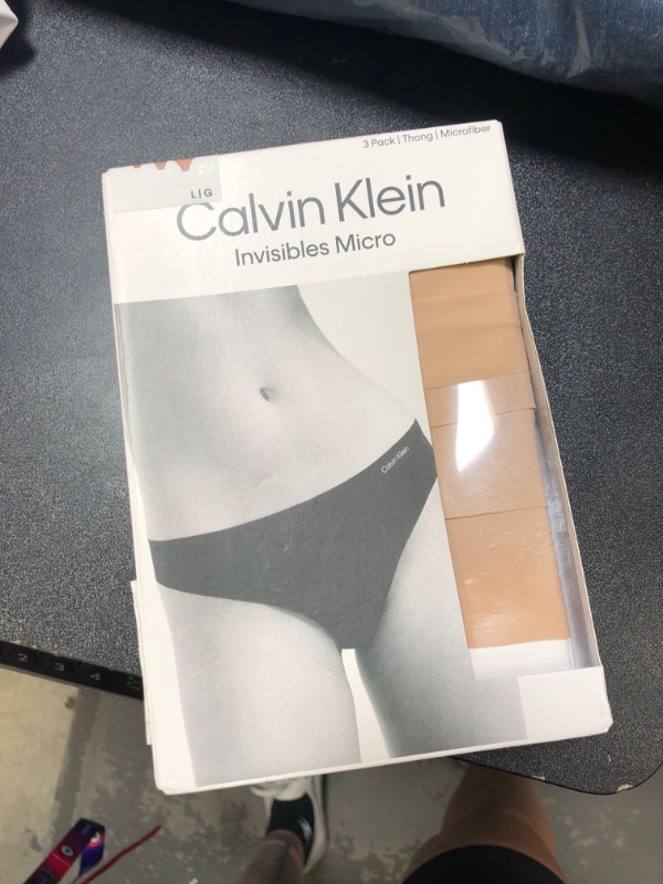 Photo 2 of Calvin Klein Women's Invisibles Seamless Thong Panties, 3 Pack
large