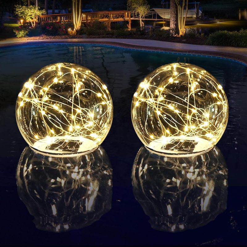 Photo 1 of LENONE Floating Pool Lights Solar Powered, 6.9" Warm White Light Up Solar Pool Lights That Float, Waterproof Solar Globe Lights for Pool, Updated Floating Pool Balls for Yard Patio Party Decor - 2PCS 2 Warm White