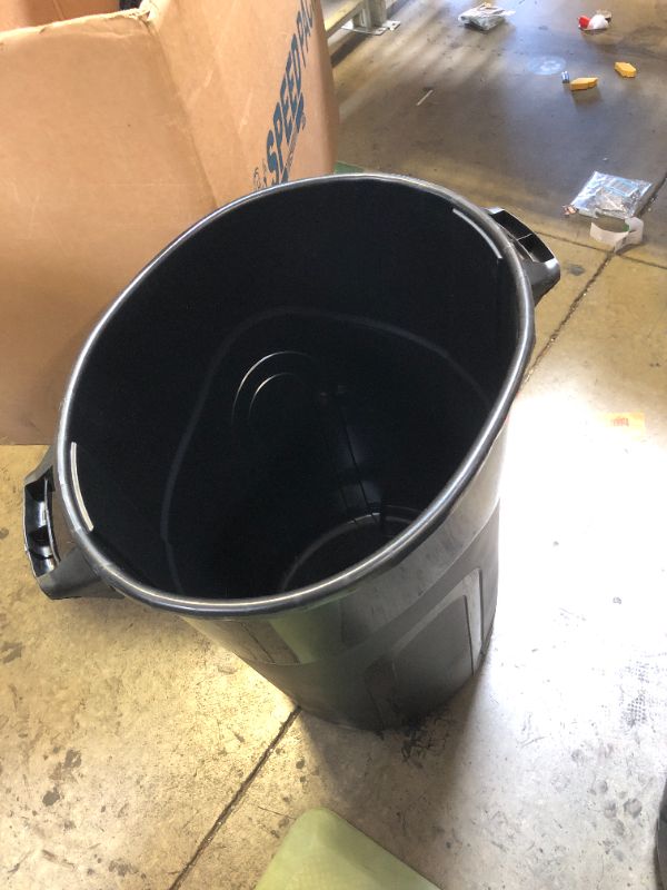 Photo 2 of 32 gallon black trashcan - missing lid - slightly smashed