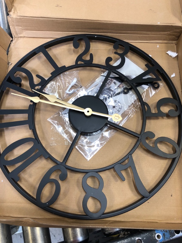 Photo 1 of Minimalistic Black Clock with Gold Hands