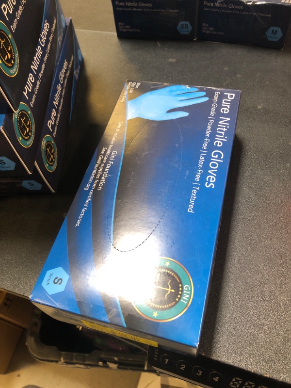 Photo 1 of PURE NITRILE GLOVES SMALL100 PC