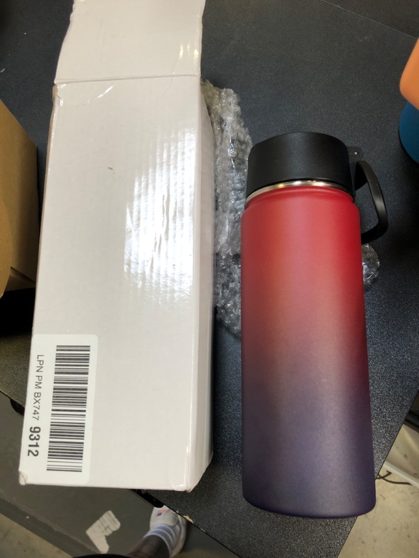 Photo 1 of 18oz water bottle red and purple 