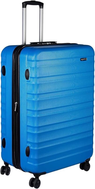 Photo 1 of Amazon Basics Expandable Hardside Luggage, Suitcase with Wheels, 28-Inch Spinner with Four Spinner Wheels and Scratch-Resistant Surface, Light BluE