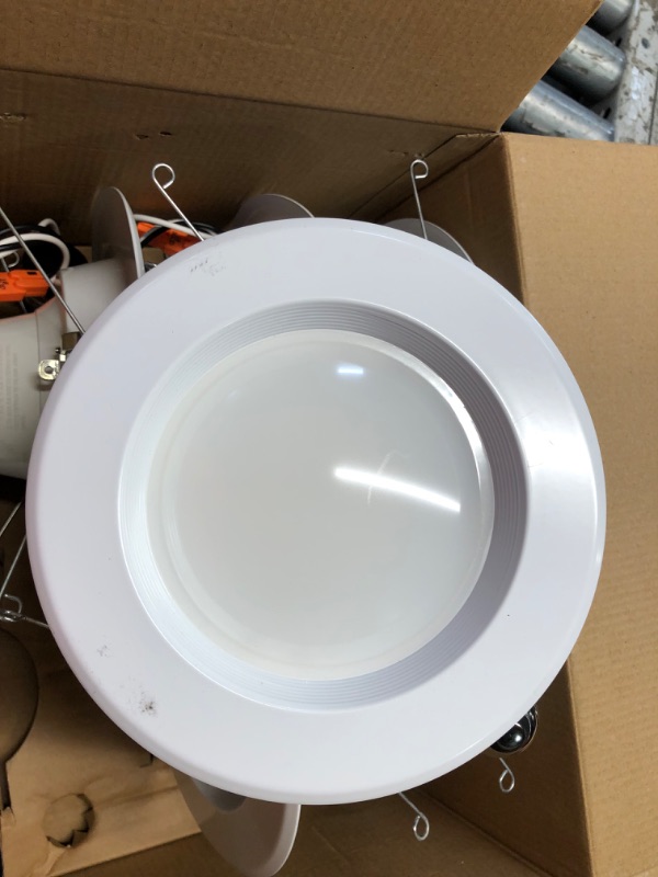 Photo 4 of ***USED - LIKELY MISSING PARTS - UNABLE TO VERIFY FUNCTIONALITY***
Feit Electric LED Recessed Downlight, fit most 5-6" Housing Cans, Baffle Trim, Dimmable, 75W Equivalent 10.2W, 925 LM Retrofit kit, 75 Watt, 2700K Soft White, 6-Pack LEDR56B/927CA/MP/6 5-6