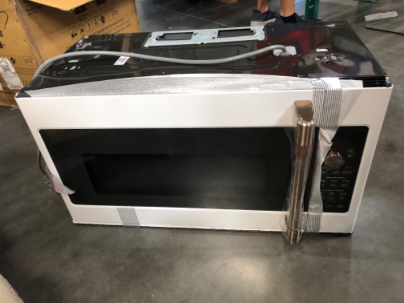 Photo 6 of ***USED - LIKELY MISSING PARTS - UNABLE TO VERIFY FUNCTIONALITY***
Cafe 1.7 Cu. Ft. Over the Range Microwave in Matte White with Air Fry