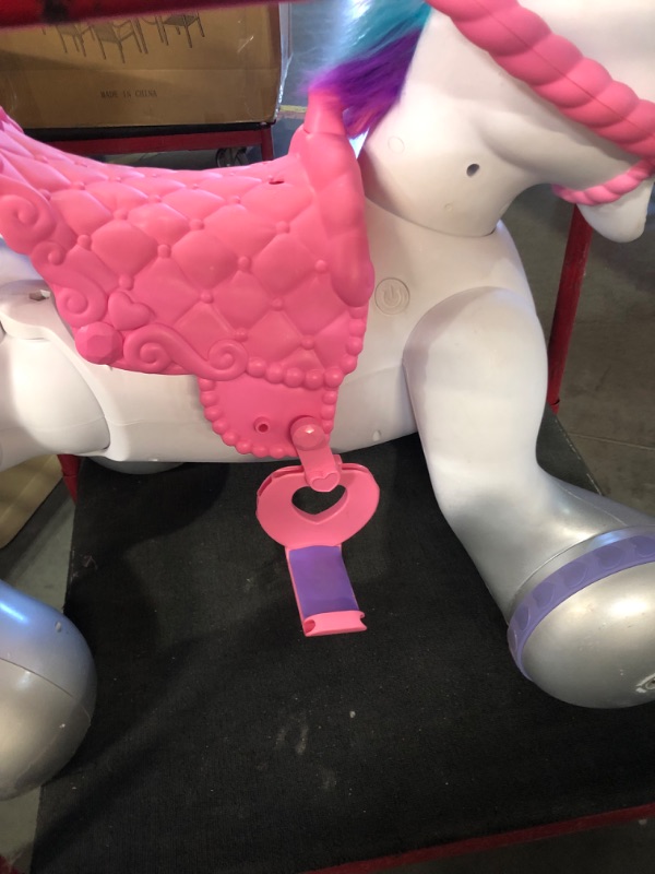 Photo 4 of ***HEAVILY USED - MISSING PARTS - DAMAGED - SEE PICTURES - UNABLE TO TEST***
Kid Trax Toddler/Kids Rideamal Unicorn 12 Volt Ride On Toy, Max Rider Weight of 70lbs, Interactive, Responds with Movement, Lights, and Sound, Accessories Included , White