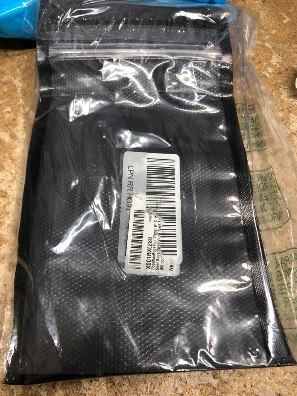Photo 1 of 50 small black bags