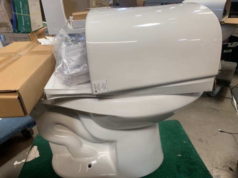 Photo 2 of 12 inch Rough In Two-Piece 1.1 GPF/1.6 GPF Dual Flush Elongated Toilet in White Seat Included
