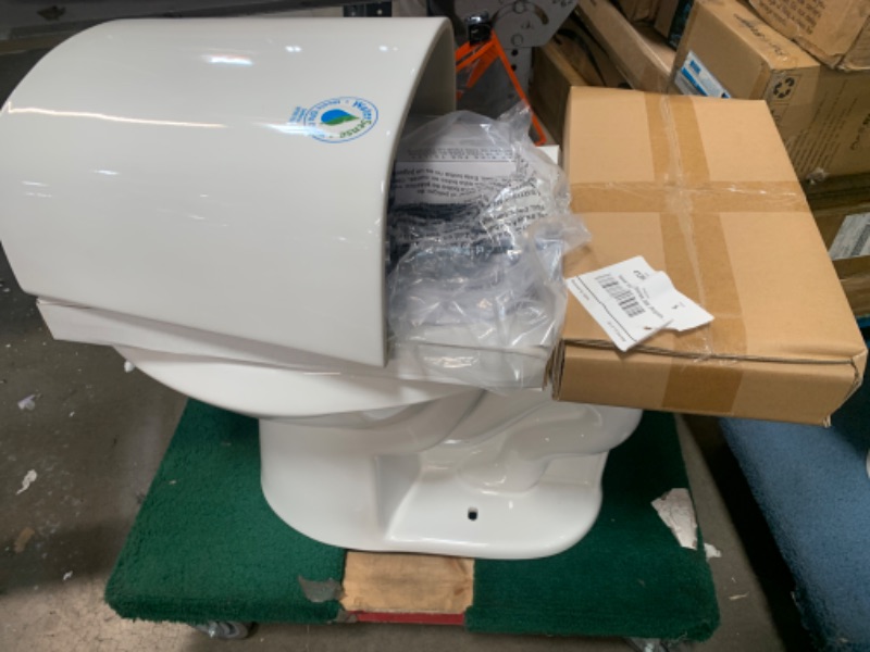 Photo 3 of 12 inch Rough In Two-Piece 1.1 GPF/1.6 GPF Dual Flush Elongated Toilet in White Seat Included
