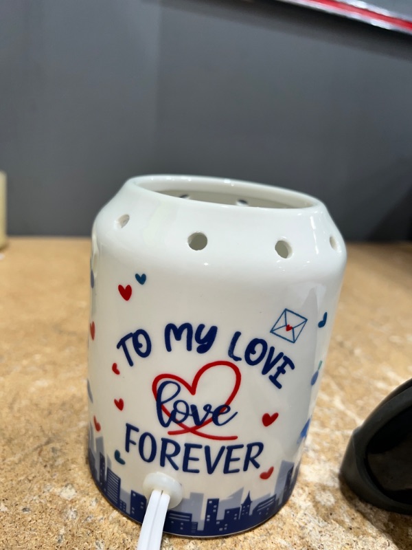 Photo 2 of A white sent oil candle with the message " TO MY LOVE FOREVER" 